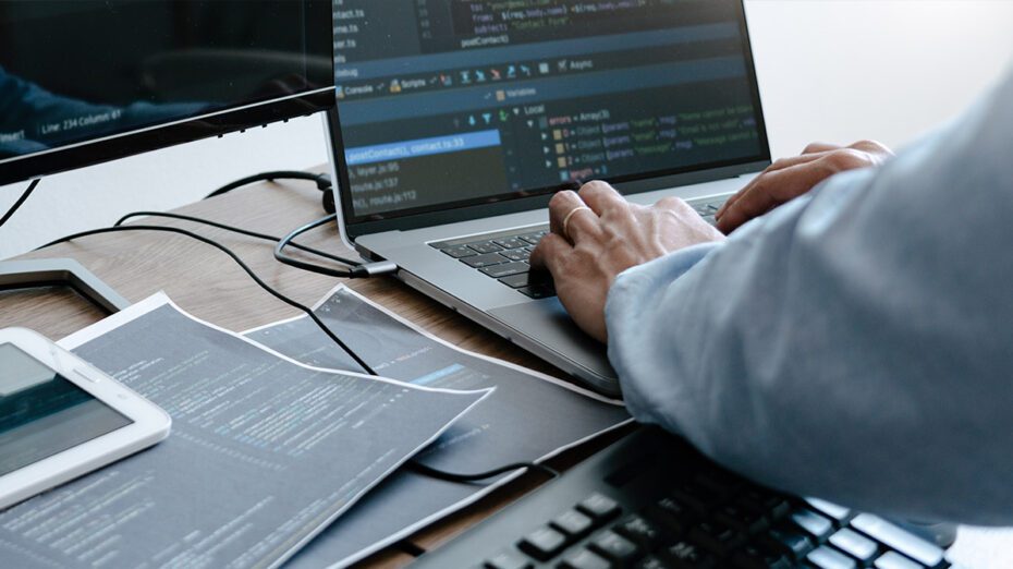 professional typing on a laptop